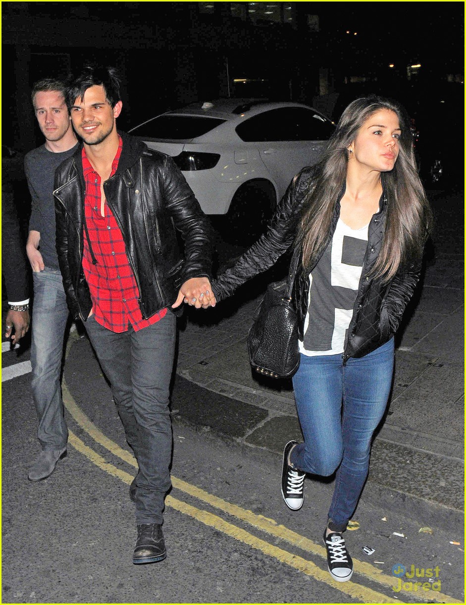 taylor lautner marie avgeropoulos matching jackets london 12